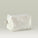 A white-coloured Tropic zippered travel bag with subtle embroidered logo, designed for storing skincare and beauty essentials.
